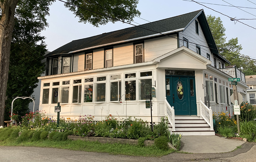 10 Cleveland Ave. Lily Dale, NY at the corner of Cleveland and North St. Present day. The Harmony House Guest House owned and operated by Ellie and Tom Cratsley.